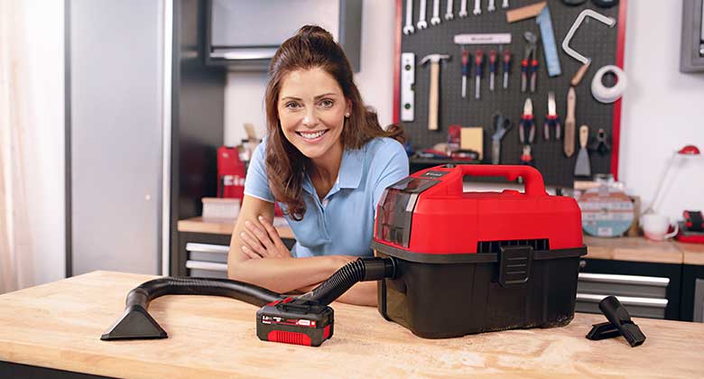 woman with cordless wet and dry vacuum cleaner