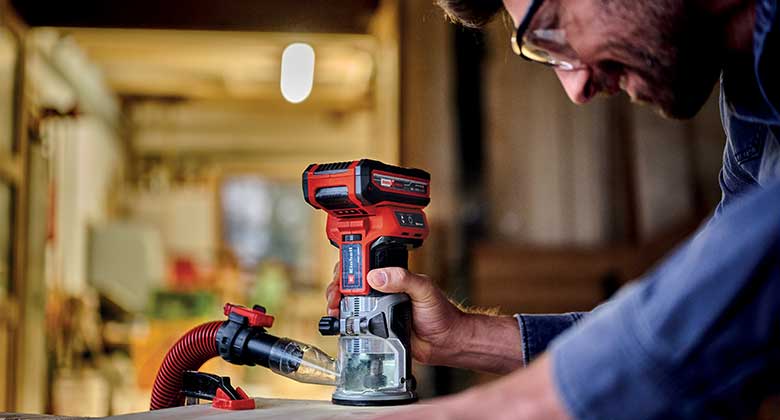 man working with a cordless router